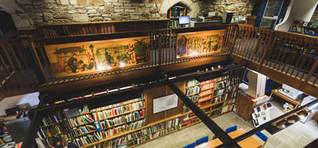 History Centre Library view from above, books and exposed brickwork 